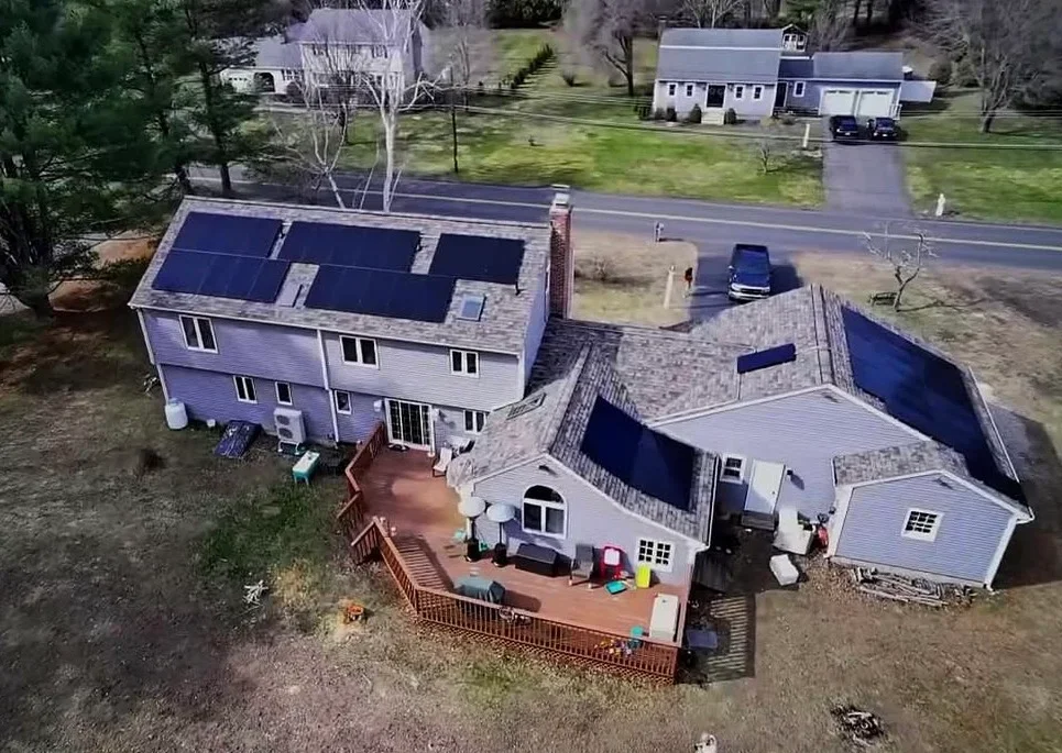 Aerial view of home with solar panels installed on roof in Granby, CT